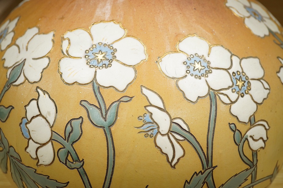 A Mettlach stoneware floral vase, impressed marks, 36cm high. Condition - fair/good